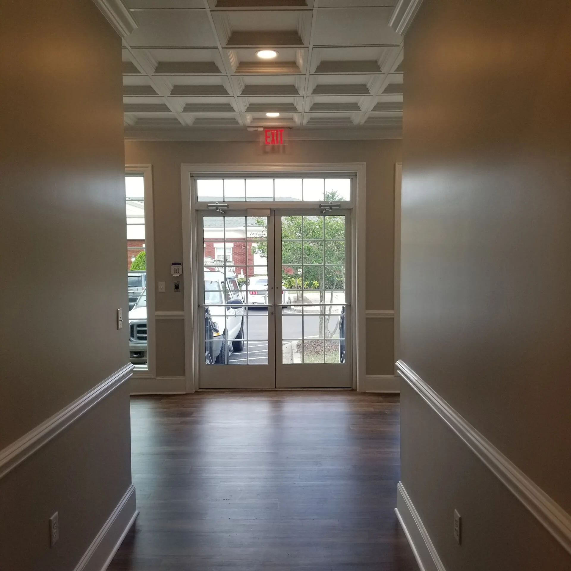 Room with full coffered ceiling and LVP flooring