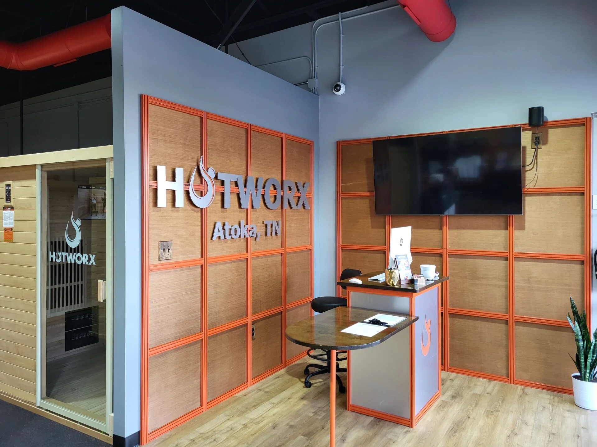 Hotworx retail merchandise display with branded Hotworx apparel