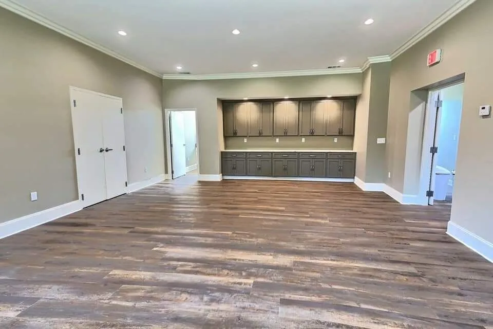 Pre-function room with custom cabinetry and wood-look flooring