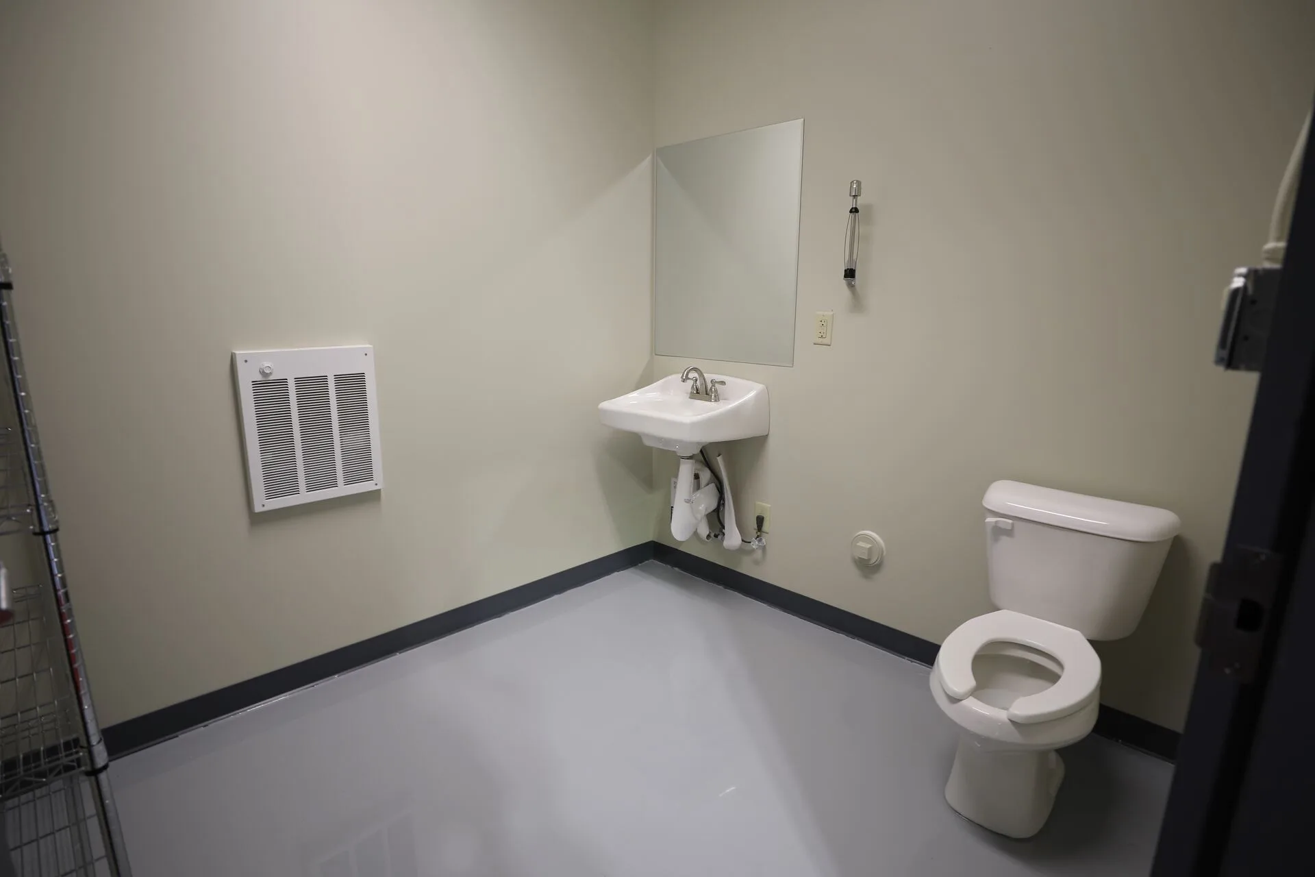 Utility bathroom with sealed epoxy floor